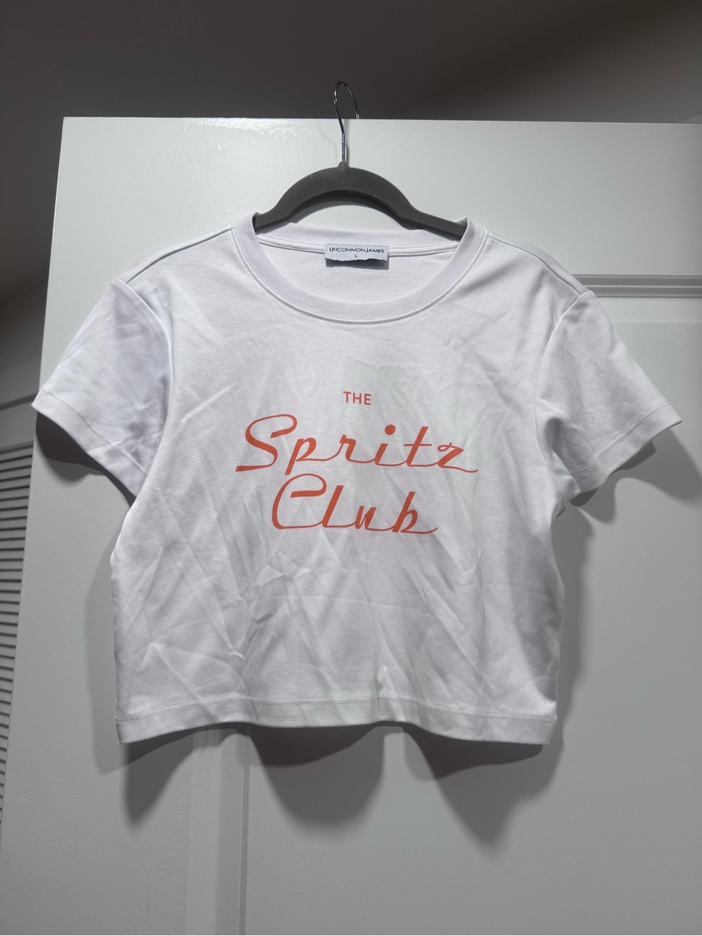 Uncommon James White Tee with Coral Script "Spritz Club"
